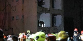 180 injured as Iran strikes towns near Israeli nuclear site First responders inslpect the site of Iranian strike on an Israeli town