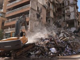 Relief for global trade as Iran ends Hormuz blockade under temporary truce Heavy machinery clears rubble from a building destroyed by airstrikes in Beirut,